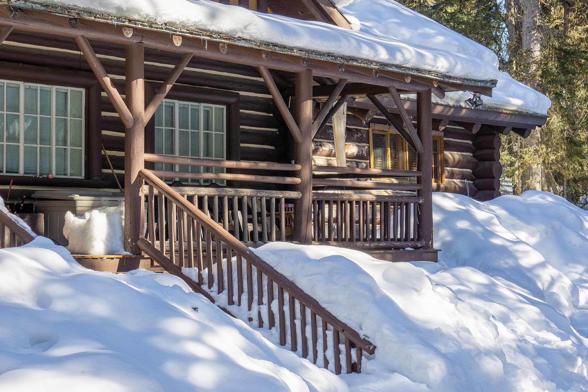 log-house-in-snow Property management services for condos, houses, cabins, off-grid homes in BC
